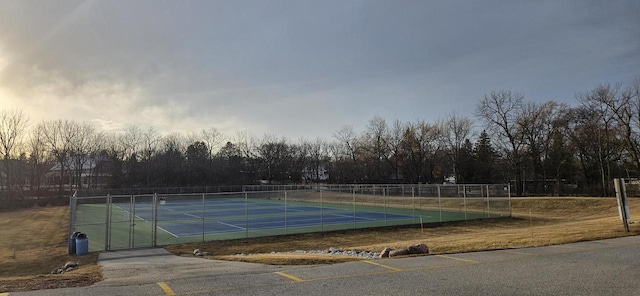 view of tennis court with fence