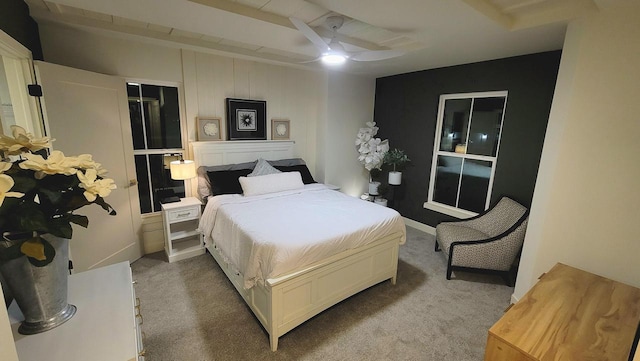 bedroom with a ceiling fan and carpet floors