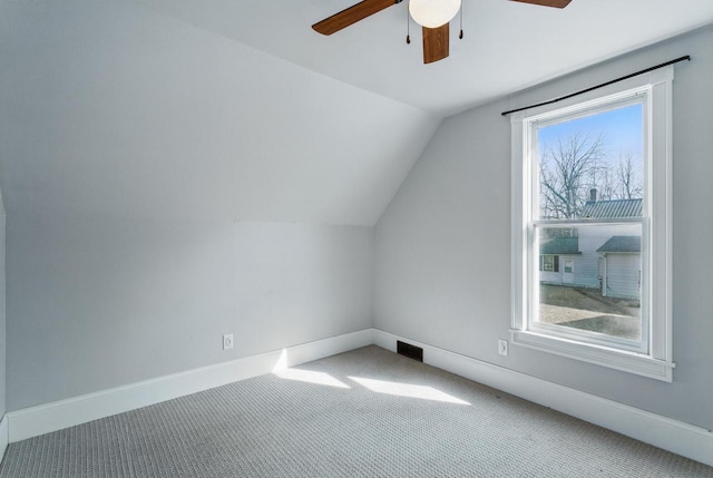 bonus room featuring visible vents, baseboards, ceiling fan, lofted ceiling, and carpet flooring