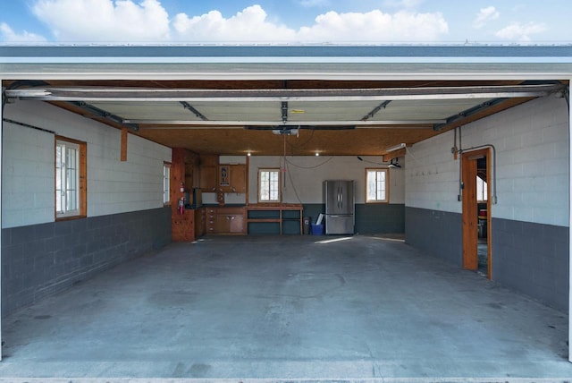 garage with freestanding refrigerator