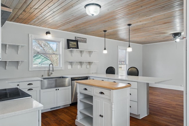 kitchen featuring wooden counters, open shelves, a peninsula, a sink, and dishwasher