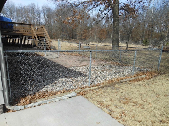 392/394 Woodbridge Way, Nekoosa, WI 54457 - view of yard featuring fence, a deck, a patio, and stairs