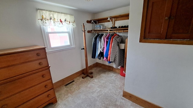 spacious closet featuring visible vents