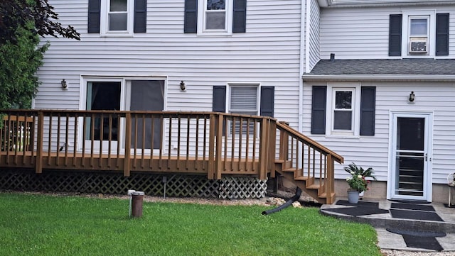 wooden terrace with a lawn