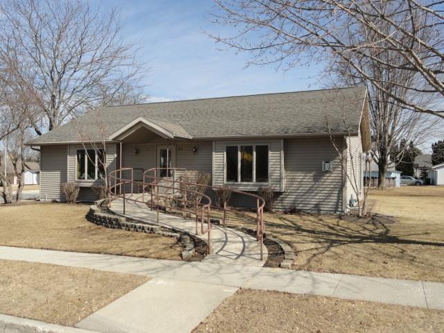 ranch-style house with a shingled roof