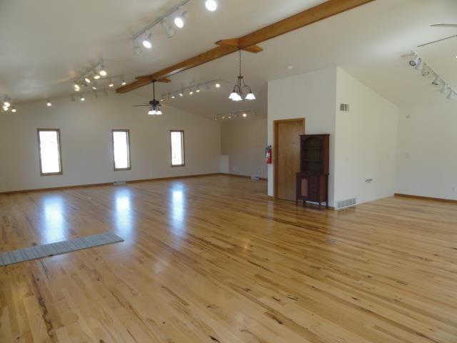 bonus room with beam ceiling, visible vents, ceiling fan with notable chandelier, and light wood-type flooring