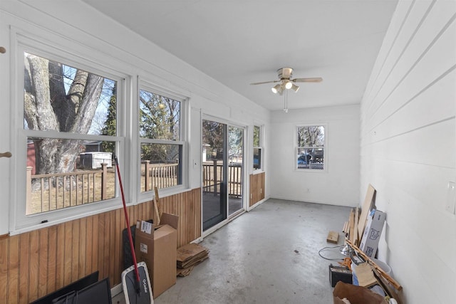 sunroom featuring a ceiling fan