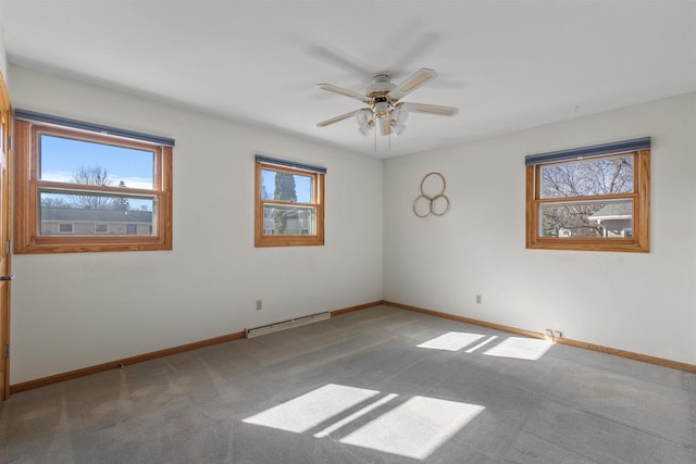 carpeted empty room featuring a baseboard radiator, baseboards, and a ceiling fan