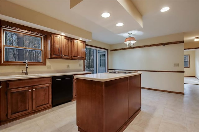 kitchen with a kitchen island, light countertops, black dishwasher, recessed lighting, and a sink