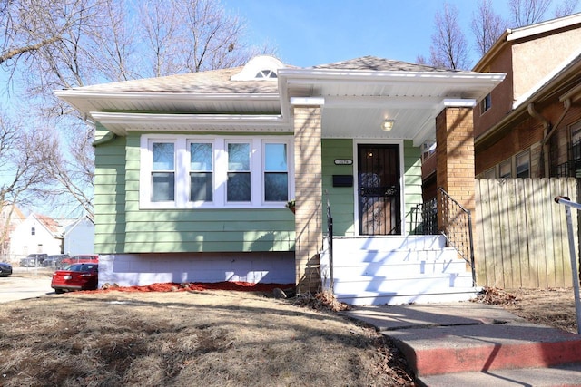 view of front of home featuring roof with shingles