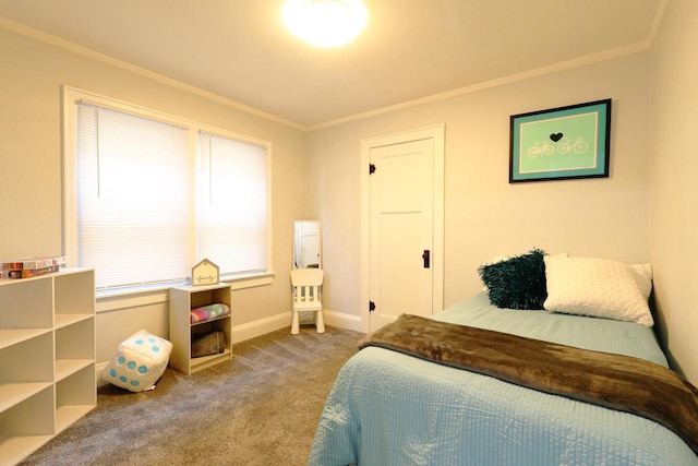 bedroom with crown molding, carpet flooring, and baseboards