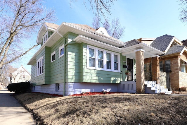 view of front of property with a shingled roof