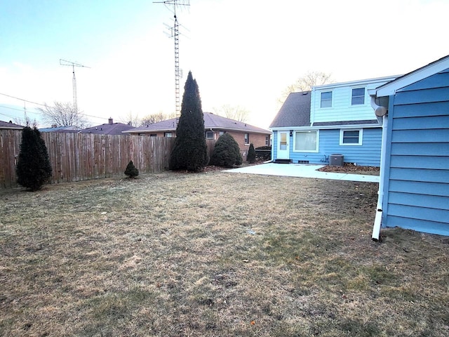 view of yard with cooling unit, a patio, and fence