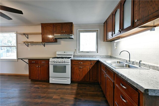 N7030 Little Valley Rd, Spooner, WI 54801 - kitchen with open shelves, ceiling fan, under cabinet range hood, white gas range oven, and a sink