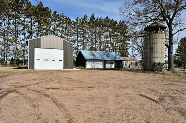 N7030 Little Valley Rd, Spooner, WI 54801 - view of outbuilding featuring an outbuilding and dirt driveway