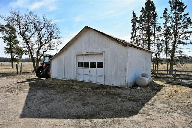 N7030 Little Valley Rd, Spooner, WI 54801 - detached garage with dirt driveway and fence