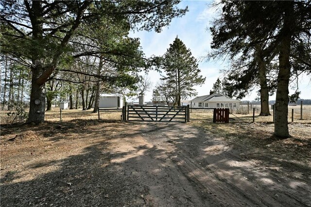 N7030 Little Valley Rd, Spooner, WI 54801 - view of yard featuring fence and a gate