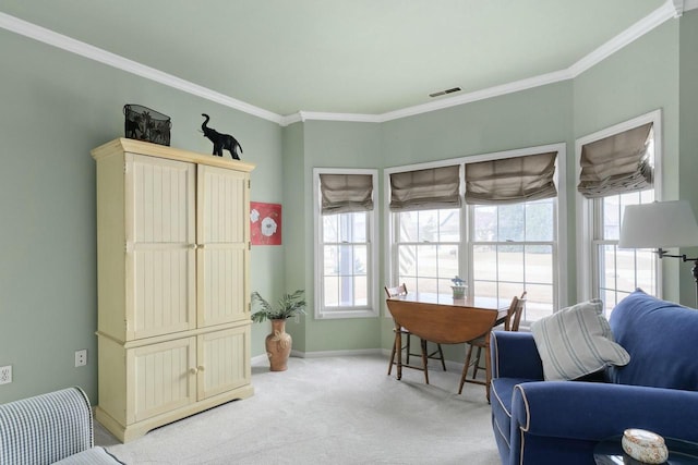 office featuring light colored carpet, visible vents, and ornamental molding