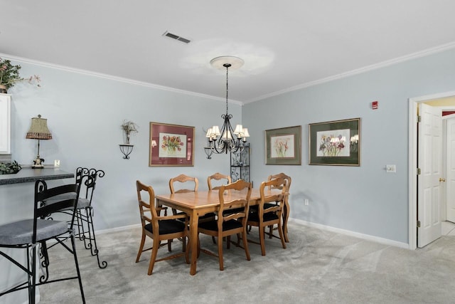 dining room featuring a notable chandelier, light colored carpet, visible vents, and ornamental molding