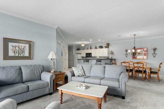 living area with an inviting chandelier, crown molding, and light colored carpet