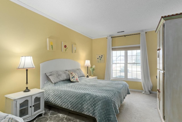 carpeted bedroom featuring visible vents, baseboards, a textured ceiling, and crown molding