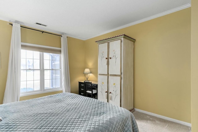 carpeted bedroom featuring visible vents, baseboards, and ornamental molding