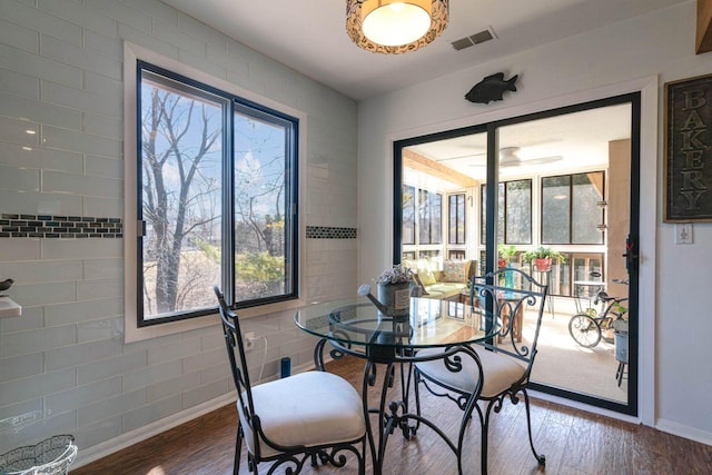 dining room with visible vents and wood finished floors