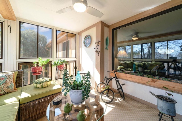 sunroom with plenty of natural light and a ceiling fan