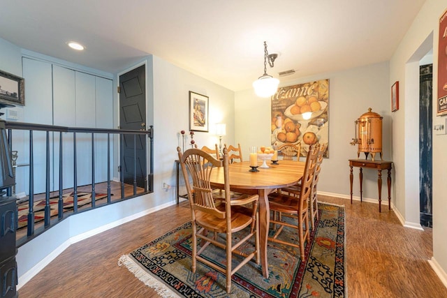 dining space with recessed lighting, visible vents, baseboards, and wood finished floors