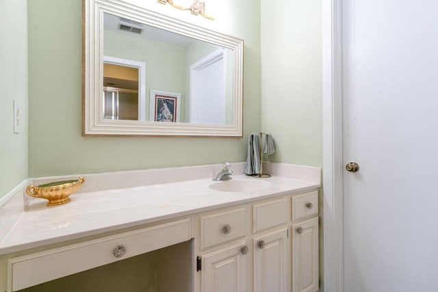 bathroom featuring vanity and visible vents