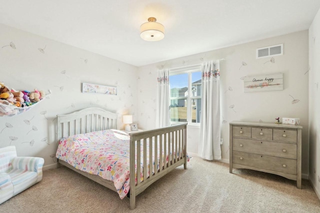 bedroom featuring visible vents, baseboards, and light colored carpet