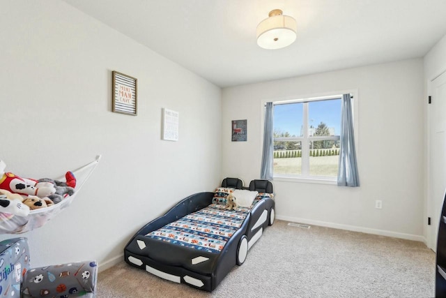 bedroom with visible vents, baseboards, and carpet