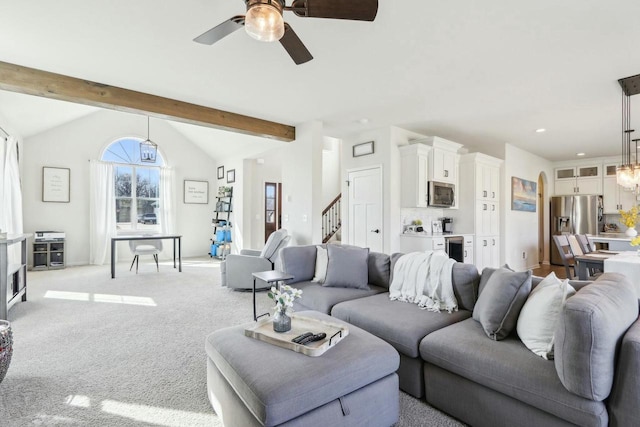 living area with recessed lighting, light colored carpet, vaulted ceiling with beams, ceiling fan, and stairs