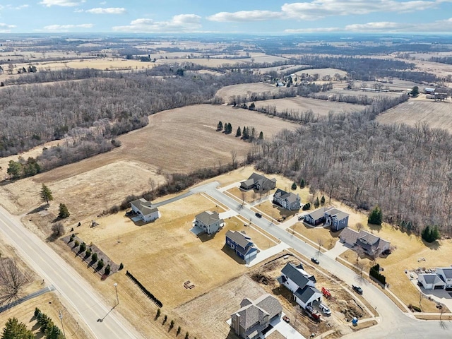 birds eye view of property with a rural view