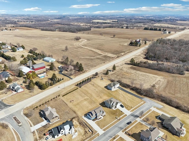 birds eye view of property featuring a rural view