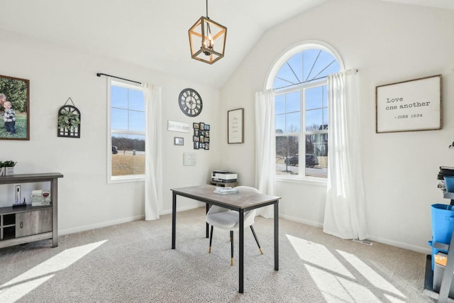 carpeted office space featuring plenty of natural light, baseboards, and lofted ceiling