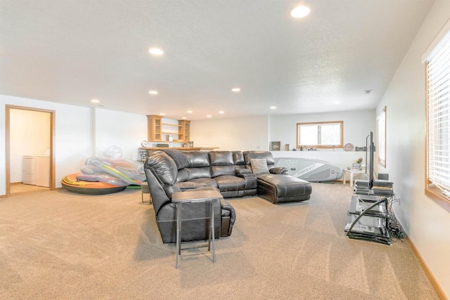 carpeted living room featuring washer / clothes dryer, recessed lighting, and baseboards