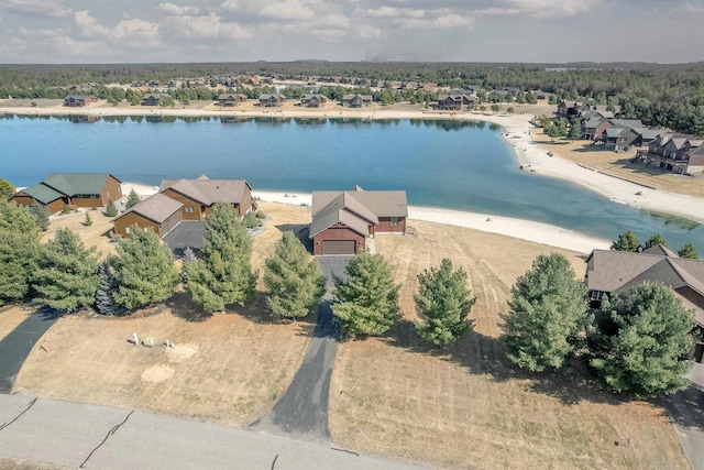 bird's eye view with a residential view and a water view