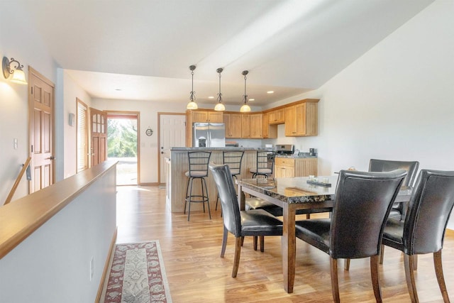 dining area featuring recessed lighting and light wood-style flooring