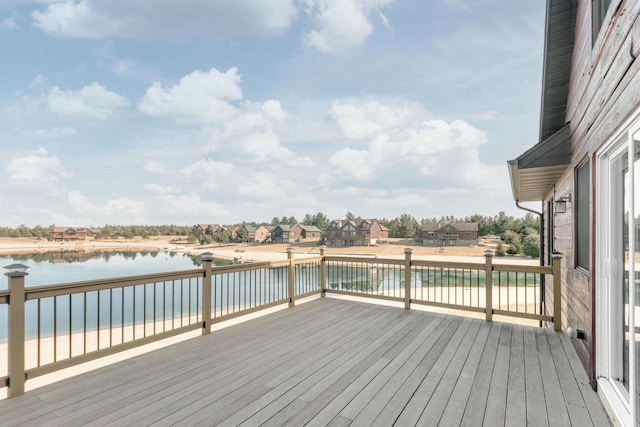 wooden deck featuring a water view