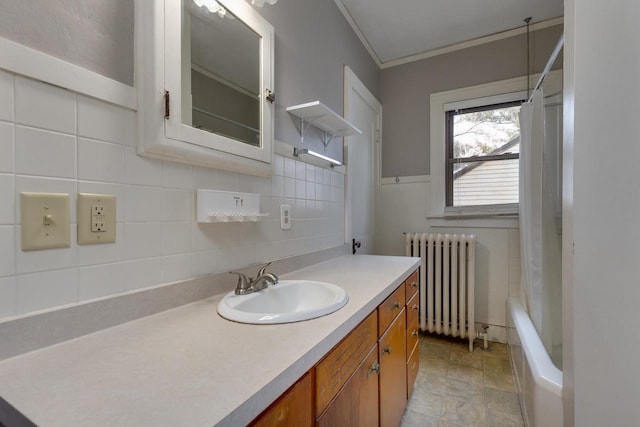 full bathroom with vanity, radiator heating unit, a tub to relax in, a shower with curtain, and tile walls