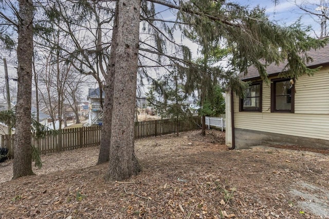 view of yard featuring fence