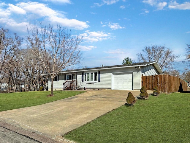 ranch-style home with a front lawn, an attached garage, fence, and concrete driveway