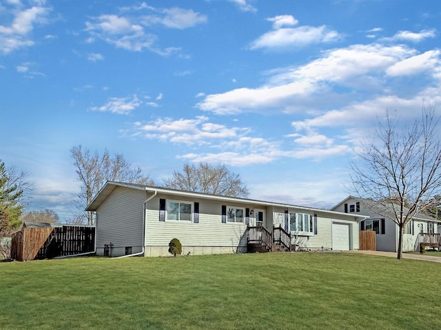 view of front facade featuring a garage, driveway, a front lawn, and fence