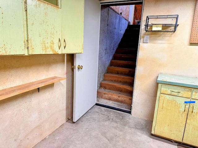 stairs with concrete floors