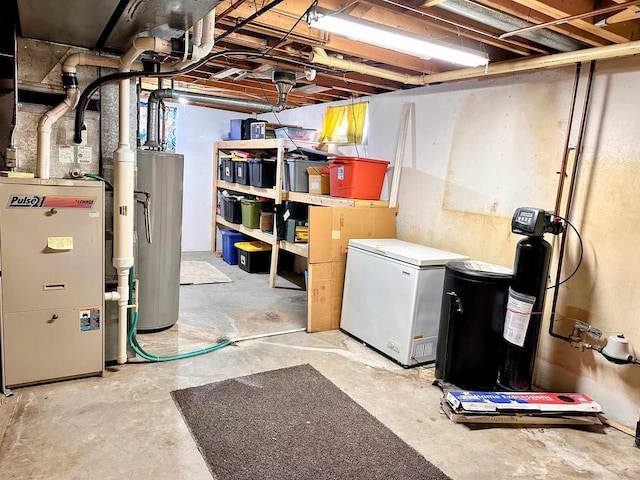 unfinished basement with fridge and water heater