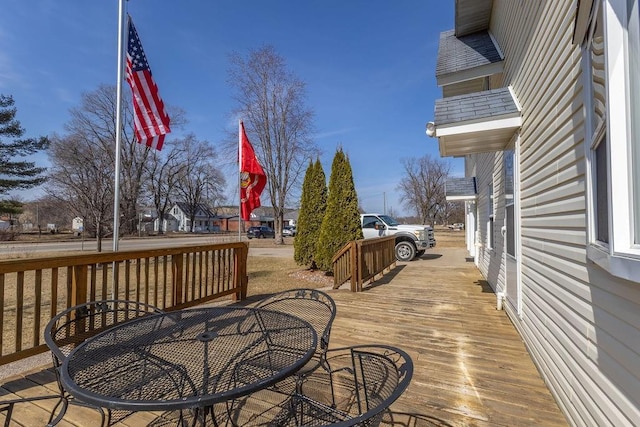 wooden deck with outdoor dining area