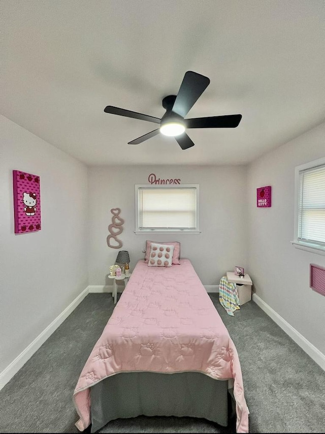 bedroom featuring a ceiling fan, baseboards, and dark colored carpet