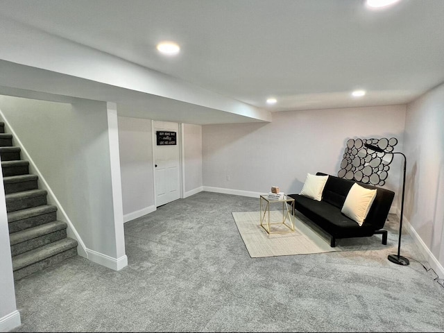 carpeted living area featuring recessed lighting, stairs, and baseboards