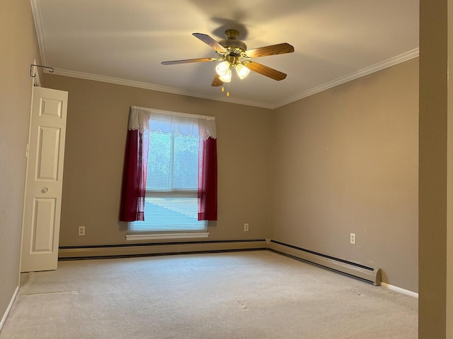 spare room with crown molding, carpet flooring, and a ceiling fan